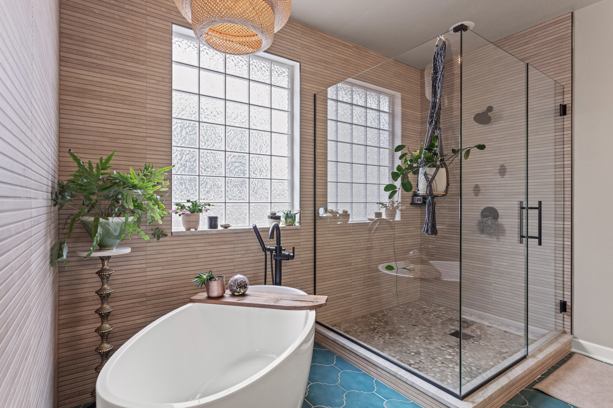 Spa-inspired Colorado bathroom with freestanding tub, glass shower, and natural wood tile design Staging Photography Lakewood Colorado